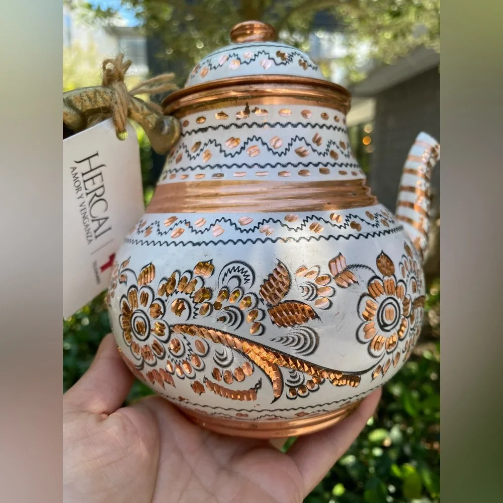 This handmade, white-painted Turkish copper teapot set features traditional